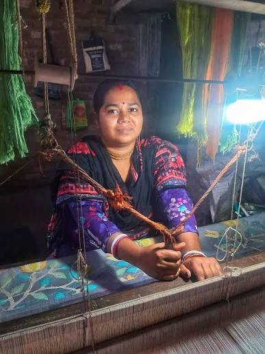 Artisan weaver at her loom